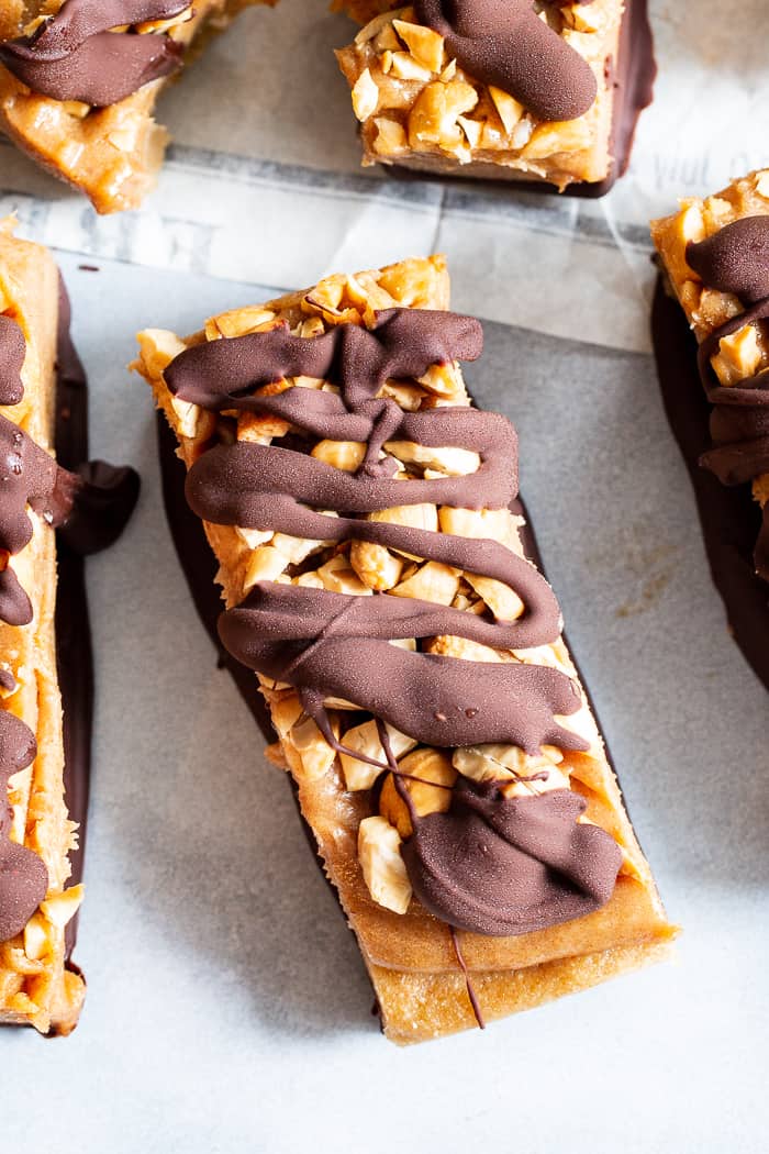 These gooey sweet healthy candy bars are packed with good for you ingredients like fruit and nuts, but taste 100% like a legit rich chewy candy bar!  These paleo and vegan candy bars are gluten free, egg free, dairy-free and free of refined sugar.  