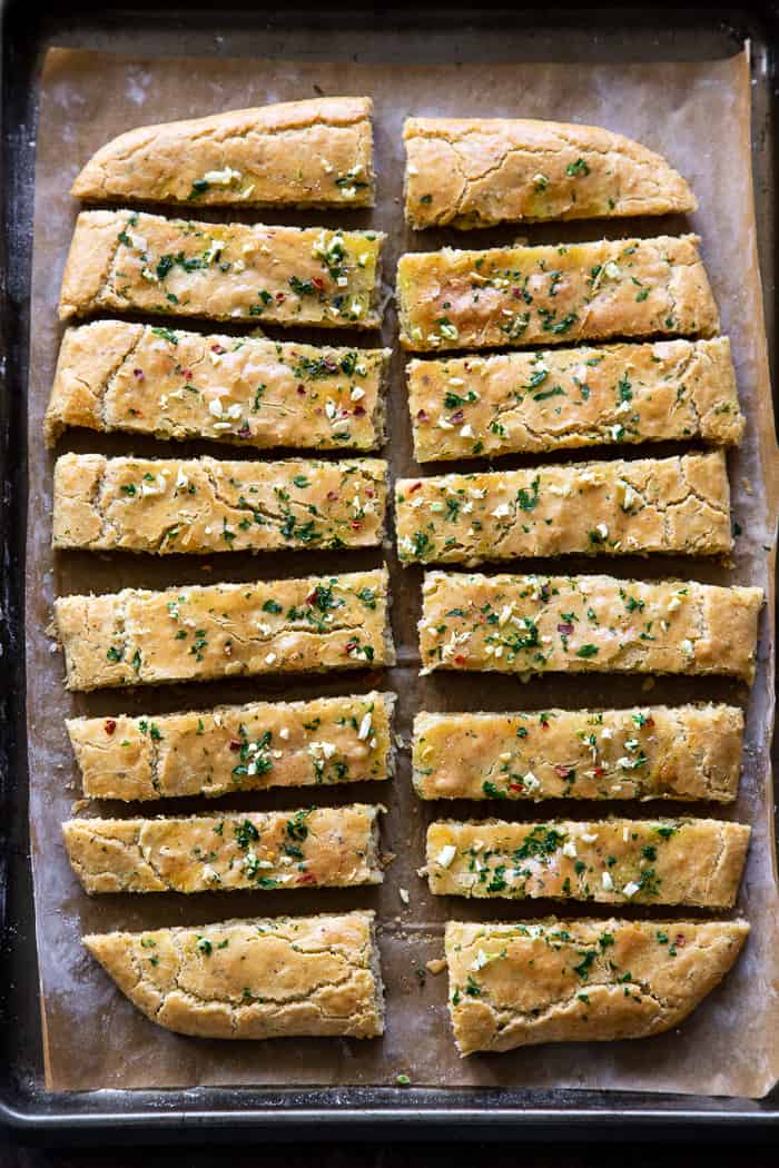 These easy, one bowl Paleo breadsticks are loaded with flavor, Italian herbs and garlic, and have the perfect chewy texture.  They're great when you’re craving bread but want to keep things clean!  Gluten-free, grain free, dairy free and perfect for dipping.