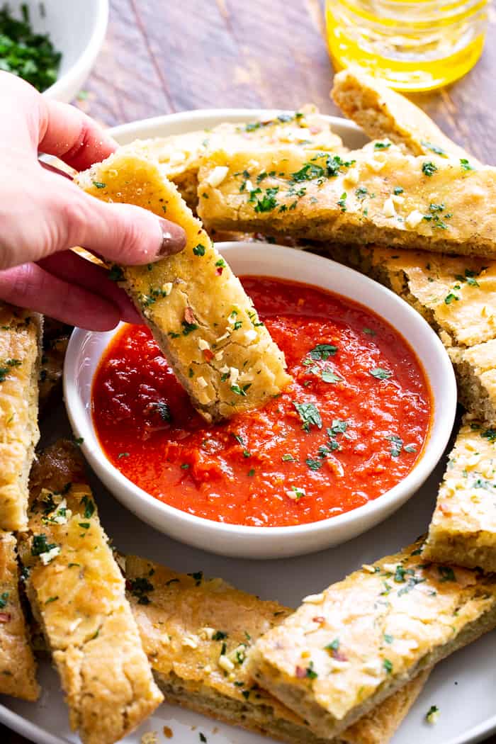 These easy, one bowl Paleo breadsticks are loaded with flavor, Italian herbs and garlic, and have the perfect chewy texture.  They're great when you’re craving bread but want to keep things clean!  Gluten-free, grain free, dairy free and perfect for dipping.