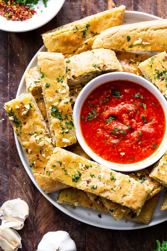 These easy, one bowl Paleo breadsticks are loaded with flavor, Italian herbs and garlic, and have the perfect chewy texture.  They're great when you’re craving bread but want to keep things clean!  Gluten-free, grain free, dairy free and perfect for dipping.