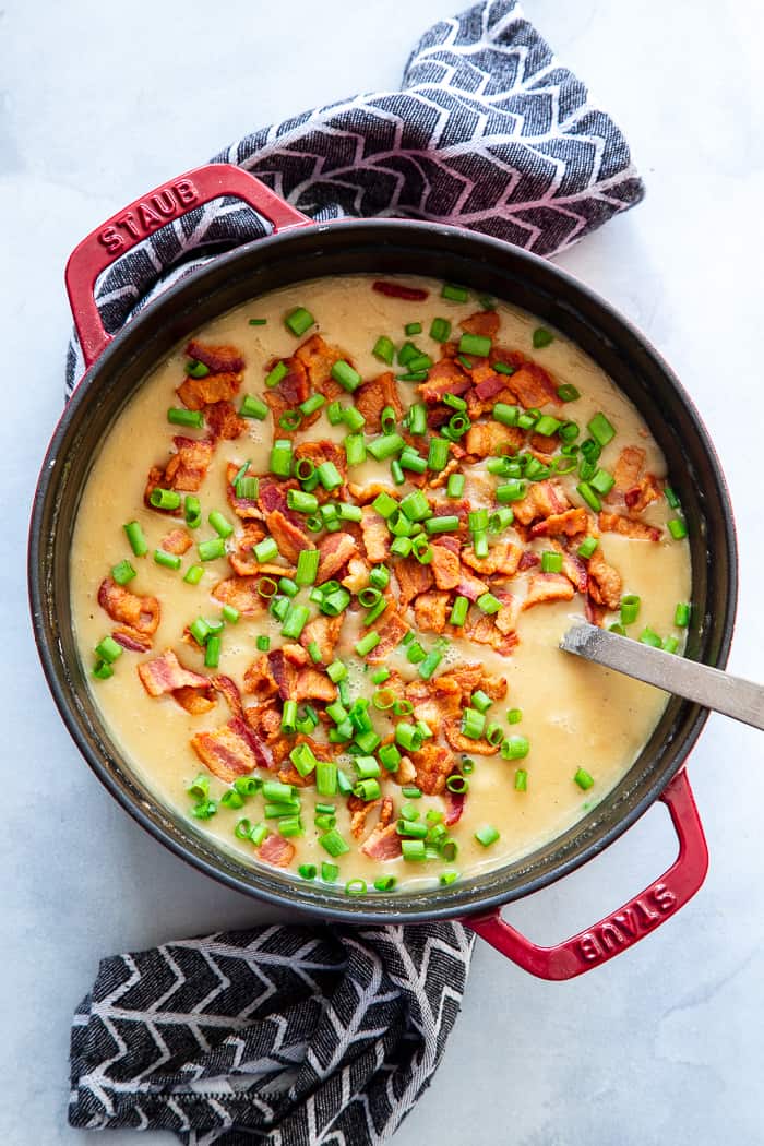 This easy and delicious creamy potato soup is loaded with flavor, bacon, and hearty chunks of potatoes too.  It’s the perfect comfort food on cold winter nights!  It’s dairy-free, Whole30 compliant and paleo friendly.