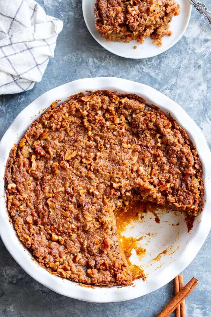 This Pumpkin Crumble has all the delicious flavors of pumpkin pie but it’s so much easier to make!  A creamy pumpkin layer is topped with a crunchy toasty grain free crumble and baked until golden brown.  Perfect for any holiday table and delicious with a dollop of whipped cream!  Paleo, gluten-free.