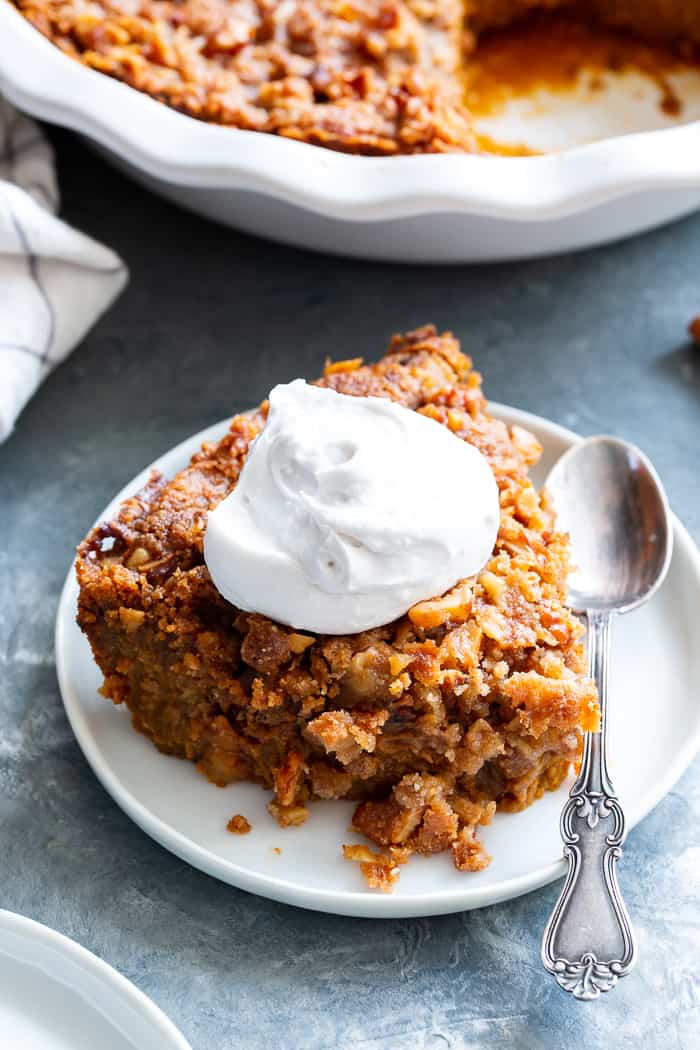 This Pumpkin Crumble has all the delicious flavors of pumpkin pie but it’s so much easier to make! A creamy pumpkin layer is topped with a crunchy toasty grain free crumble and baked until golden brown. Perfect for any holiday table and delicious with a dollop of whipped cream! 