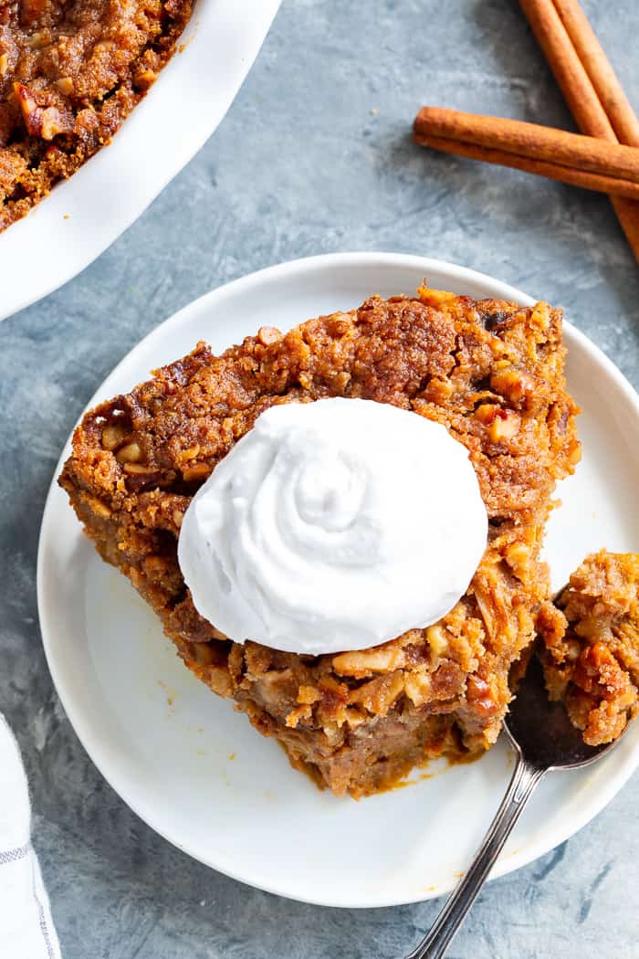 This Pumpkin Crumble has all the delicious flavors of pumpkin pie but it’s so much easier to make!  A creamy pumpkin layer is topped with a crunchy toasty grain free crumble and baked until golden brown.  Perfect for any holiday table and delicious with a dollop of whipped cream!  Paleo, gluten-free.