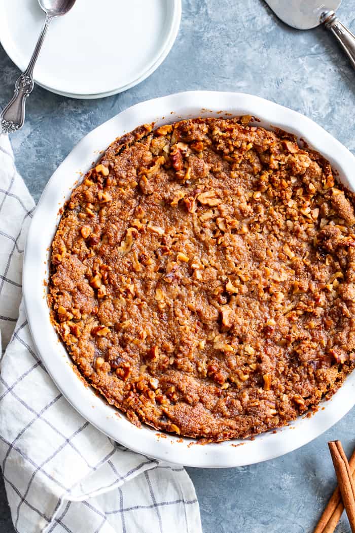 This Pumpkin Crumble has all the delicious flavors of pumpkin pie but it’s so much easier to make!  A creamy pumpkin layer is topped with a crunchy toasty grain free crumble and baked until golden brown.  Perfect for any holiday table and delicious with a dollop of whipped cream!  Paleo, gluten-free.