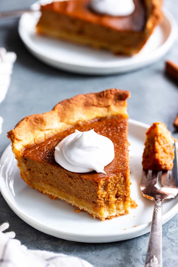 This Paleo Sweet Potato Pie will be a showstopper on your holiday table!  With a grain free and paleo crust that tastes just like the real deal, and a creamy filling filled with sweet warm spices, you’ll be hooked with the first bite.  It’s gluten-free, grain free, refined sugar free, and has a dairy free option.  