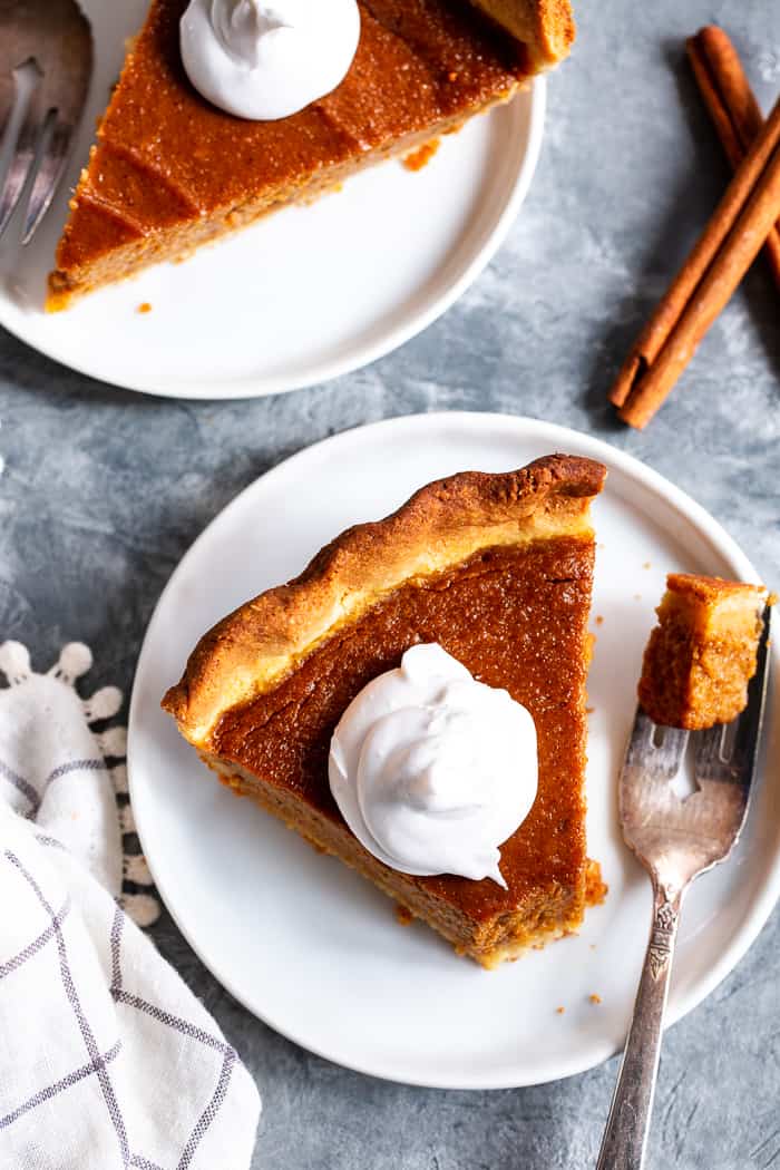 This Paleo Sweet Potato Pie will be a showstopper on your holiday table!  With a grain free and paleo crust that tastes just like the real deal, and a creamy filling filled with sweet warm spices, you’ll be hooked with the first bite.  It’s gluten-free, grain free, refined sugar free, and has a dairy free option.  