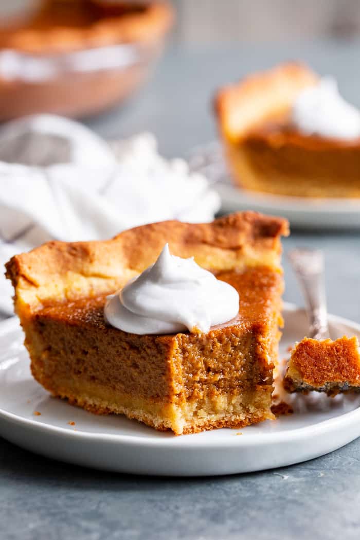 This Paleo Sweet Potato Pie will be a showstopper on your holiday table!  With a grain free and paleo crust that tastes just like the real deal, and a creamy filling filled with sweet warm spices, you’ll be hooked with the first bite.  It’s gluten-free, grain free, refined sugar free, and has a dairy free option.  