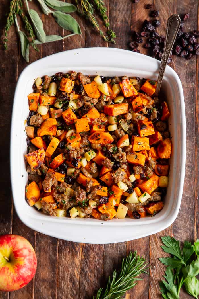 This delicious Paleo Sweet Potato Stuffing with Jones Dairy Farm No Sugar All Natural Pork Sausage Roll, apples and cranberries has all the flavor of traditional Thanksgiving stuffing but is grain free, gluten free, dairy free and Whole30 compliant too! Toasty, roasted sweet potatoes and savory, all natural sausage form the base of this favorite holiday side dish. It’s sweet savory perfection! #AD #Jonesdairyfarm