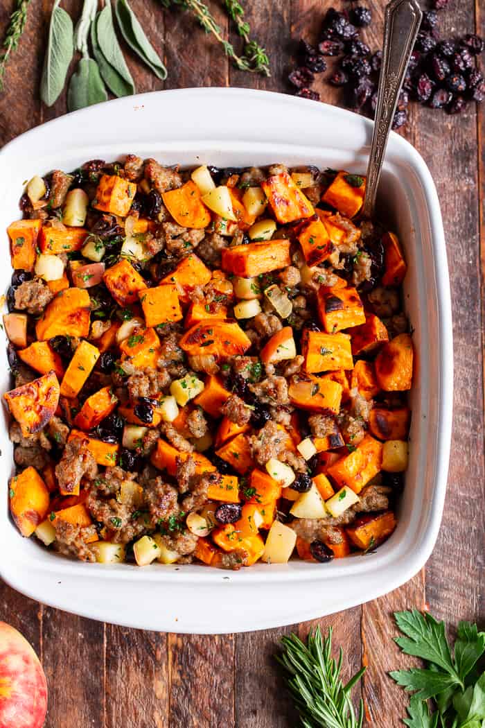 This delicious Paleo Sweet Potato Stuffing with Jones Dairy Farm No Sugar All Natural Pork Sausage Roll, apples and cranberries has all the flavor of traditional Thanksgiving stuffing but is grain free, gluten free, dairy free and Whole30 compliant too! Toasty, roasted sweet potatoes and savory, all natural sausage form the base of this favorite holiday side dish. It’s sweet savory perfection! #AD #Jonesdairyfarm