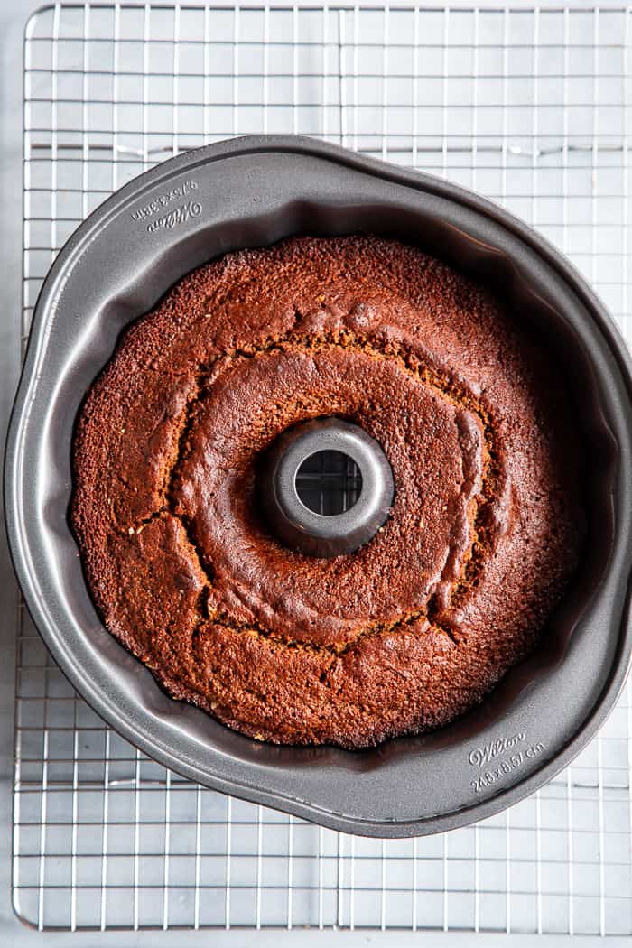 This grain free and paleo Gingerbread Bundt Cake is moist and tender, with a sweet cinnamon maple pecan swirl!  Topped with a sweet maple glaze, this gluten-free, dairy-free cake is sure to be a favorite for the holiday season!