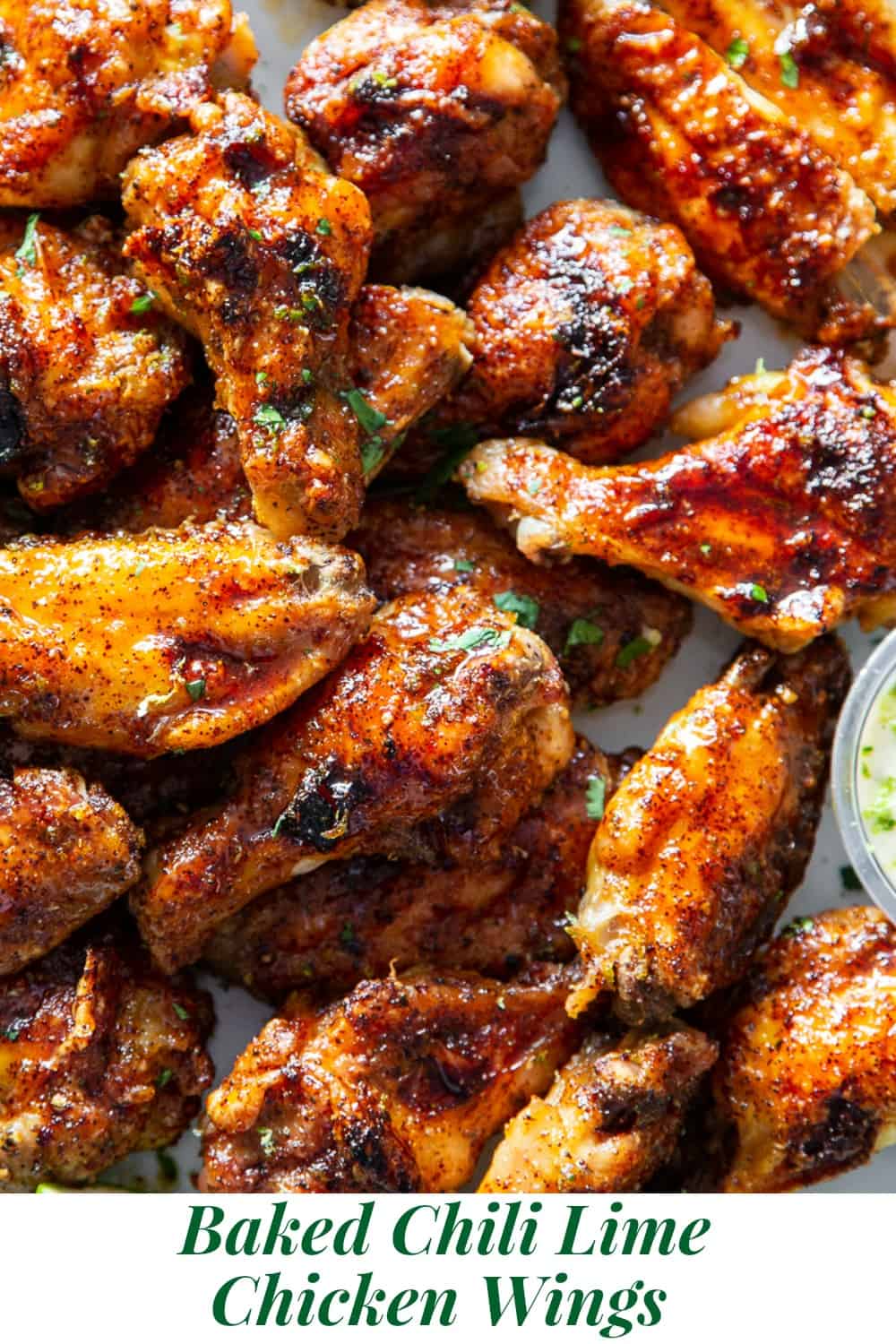 These sweet and spicy chili lime chicken wings are packed with flavor and perfect for parties, appetizers or a fun dinner!  These crispy baked chicken wings are paleo with a Whole30 option to sweeten the sauce, family friendly and a total crowd pleaser. #Paleo #cleaneating #wings #whole30 #superbowl