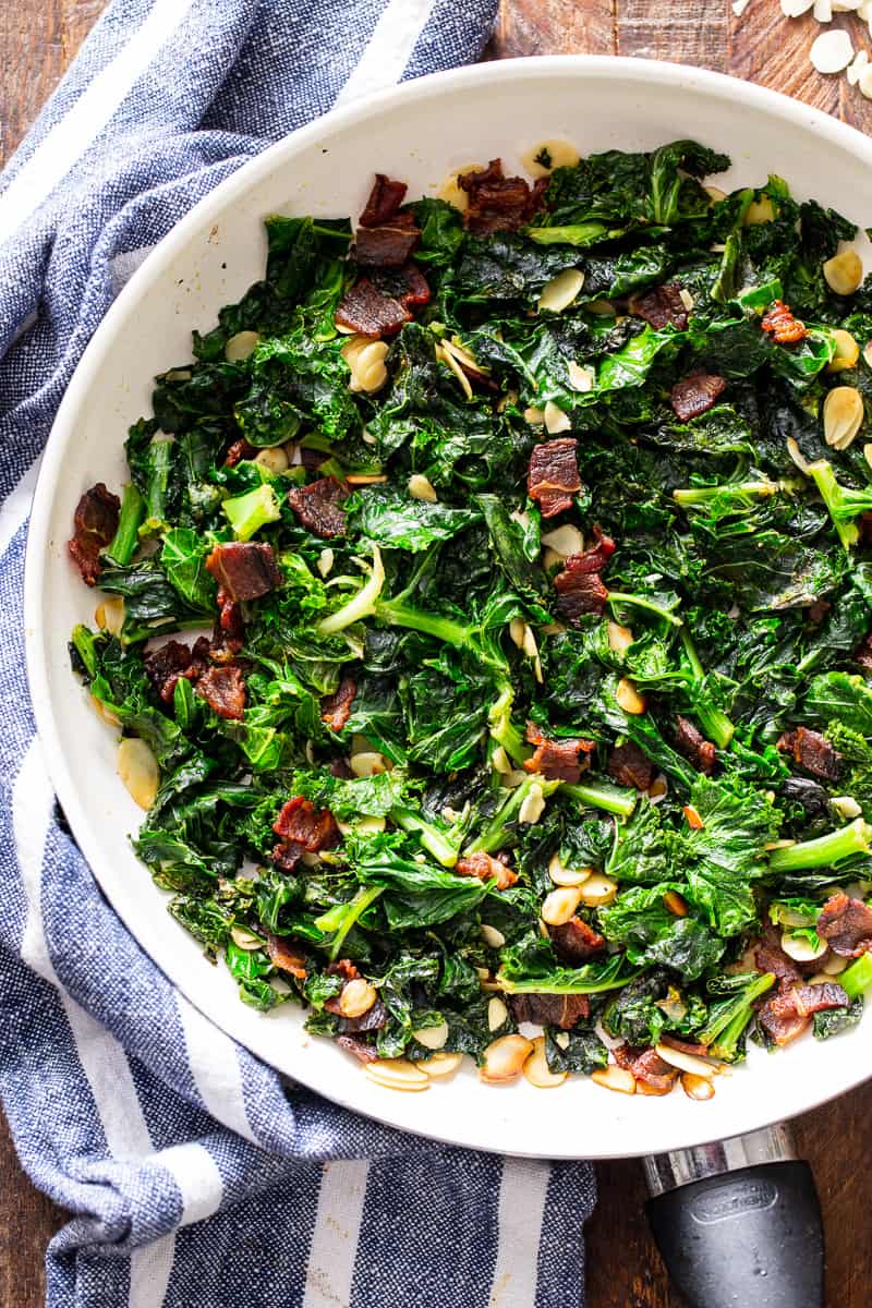 This delicious and simple sautéed kale with bacon and almonds is a savory healthy side dish that you’ll want on repeat!  It’s paleo and Whole30 friendly, keto, and Low FODMAP.  Serve it with any main course to add lots of flavor and nutrients to your meal.
