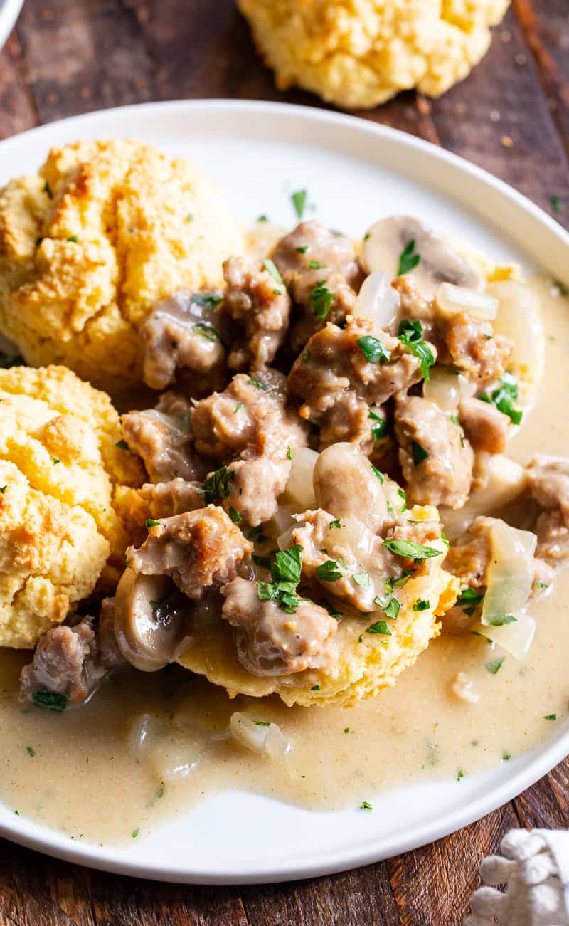 Easy to make, quick and healthy mushroom sausage gravy with paleo and keto friendly biscuits. This meal is great anytime you’re craving savory, hearty comfort food. Gluten free, dairy free, sugar free. 