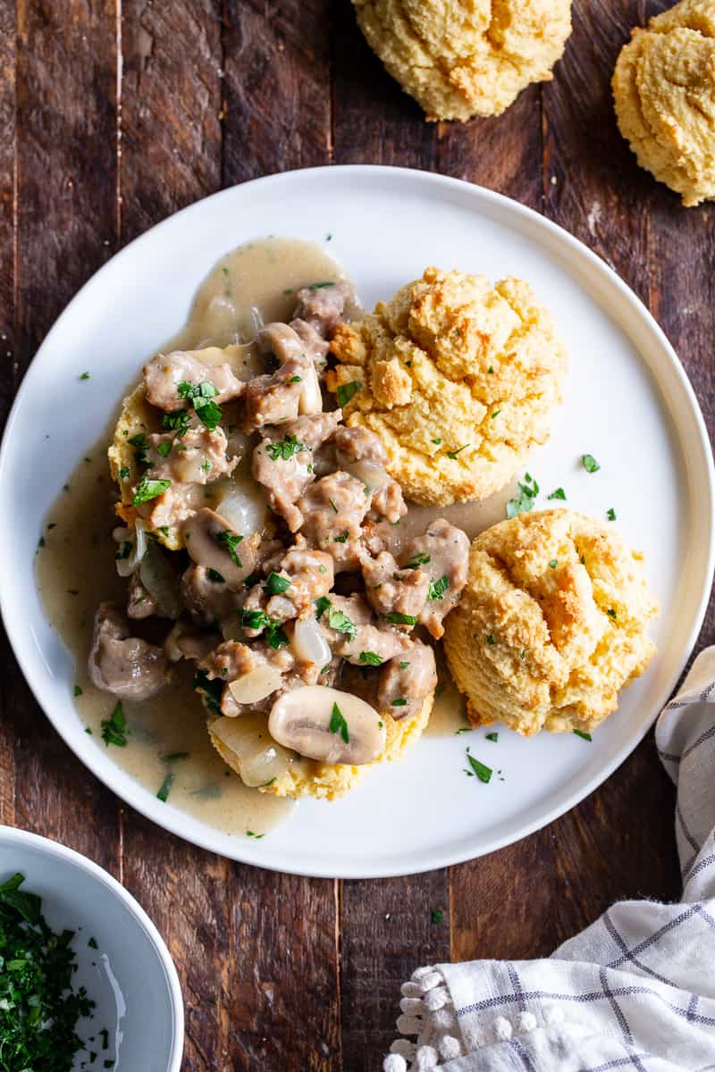 Easy to make, quick and healthy mushroom sausage gravy with paleo and keto friendly biscuits. This meal is great anytime you’re craving savory, hearty comfort food. Gluten free, dairy free, sugar free. 