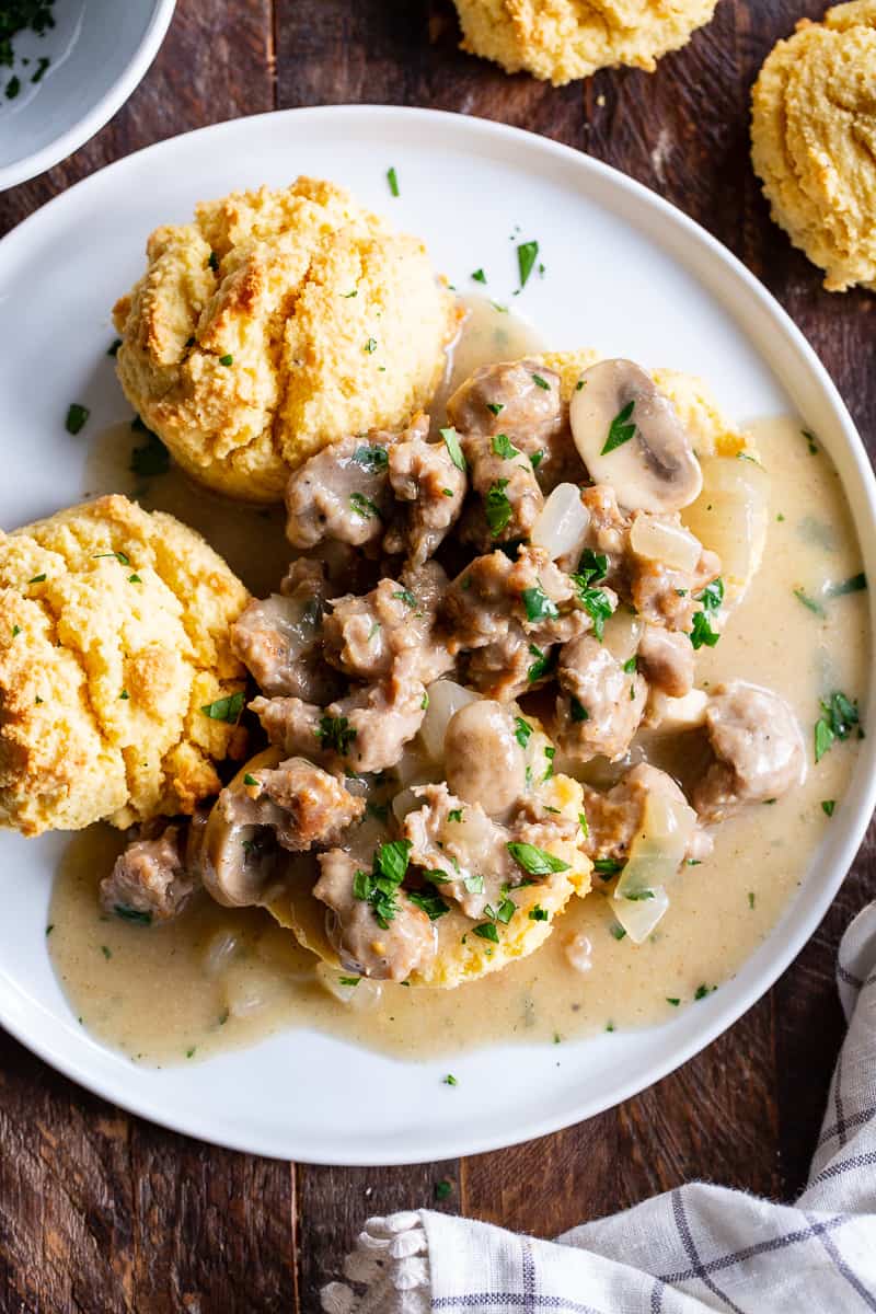 Easy to make, quick and healthy mushroom sausage gravy with paleo and keto friendly biscuits. This meal is great anytime you’re craving savory, hearty comfort food. Gluten free, dairy free, sugar free. 