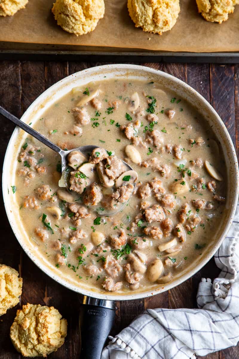 Easy to make, quick and healthy mushroom sausage gravy with paleo and keto friendly biscuits. This meal is great anytime you’re craving savory, hearty comfort food. Gluten free, dairy free, sugar free. 