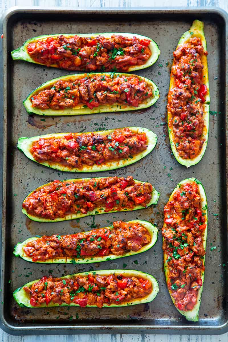 These hearty Italian Zucchini Boats are flavor packed and make a quick, healthy and fun dinner!   They're also perfect to meal prep ahead of time for busy nights and are totally dairy-free, grain free, keto, paleo and Whole30 compliant, and Low FODMAP. #cleaneating #lowFODMAP #keto #paleo