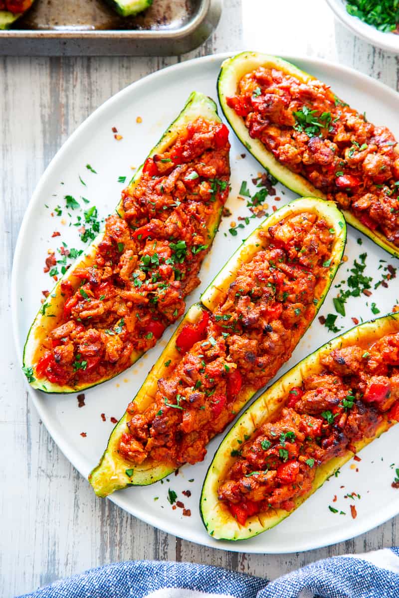 These hearty Italian Zucchini Boats are flavor packed and make a quick, healthy and fun dinner!   They're also perfect to meal prep ahead of time for busy nights and are totally dairy-free, grain free, keto, paleo and Whole30 compliant, and Low FODMAP. #cleaneating #lowFODMAP #keto #paleo