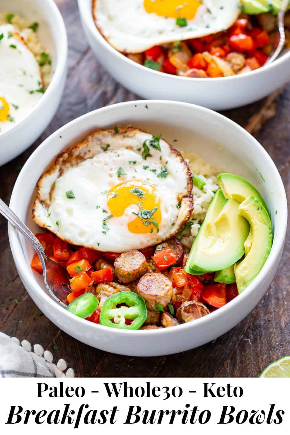 These Paleo breakfast burrito bowls are loaded with goodies!  Savory No Antibiotics Ever All Natural Golden Brown Chicken Sausage, peppers, onions, and seasoned cauliflower rice topped with sliced avocado and eggs. These delicious breakfast bowls are low carb, Whole30 compliant and super easy to throw together!