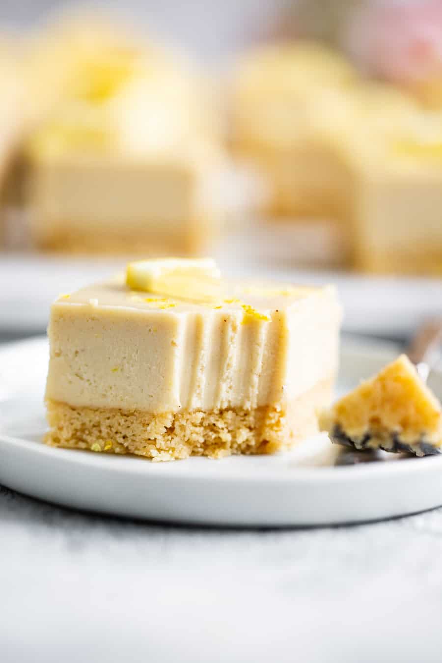 These tart, sweet, paleo lemon bars have a sugar cookie crust and creamy cashew based lemon layer. This healthy spring dessert is totally dairy free, paleo, egg free with a vegan option. Great easy dessert for holidays like Mother’s Day and Easter. I used affordable paleo baking ingredients from ALDI to make all the flavors shine. #paleo #cleaneating #vegan #AD 