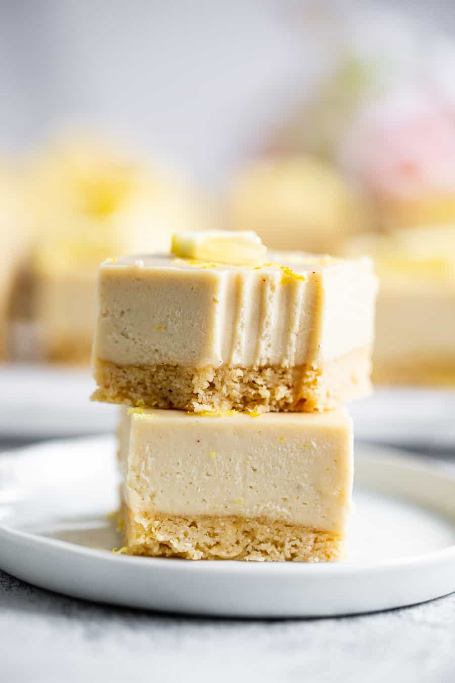 These tart, sweet, paleo lemon bars have a sugar cookie crust and creamy cashew based lemon layer. This healthy spring dessert is totally dairy free, paleo, egg free with a vegan option. Great easy dessert for holidays like Mother’s Day and Easter. I used affordable paleo baking ingredients from ALDI to make all the flavors shine. #paleo #cleaneating #vegan #AD 