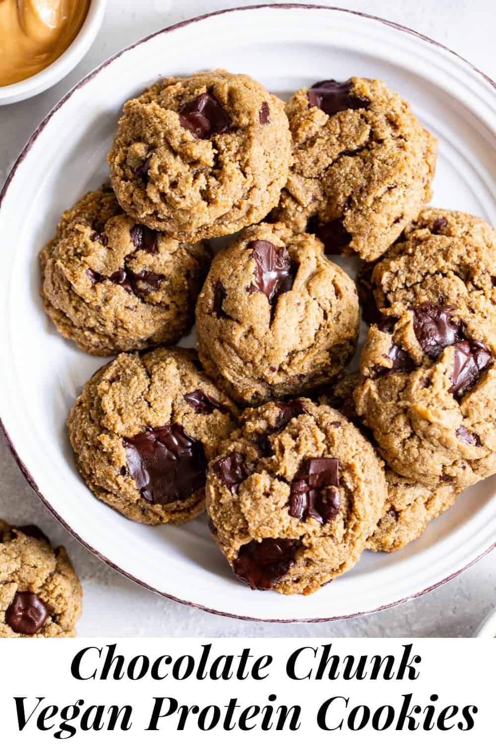 These soft and chewy chocolate chunk protein cookies are packed with good for you ingredients but taste decadent!  Plant based vanilla protein, nut butter, pure maple syrup and almond flour make these paleo and vegan cookies just as healthy as they are delicious. #ad #paleo #vegan #cookies #glutenfree 