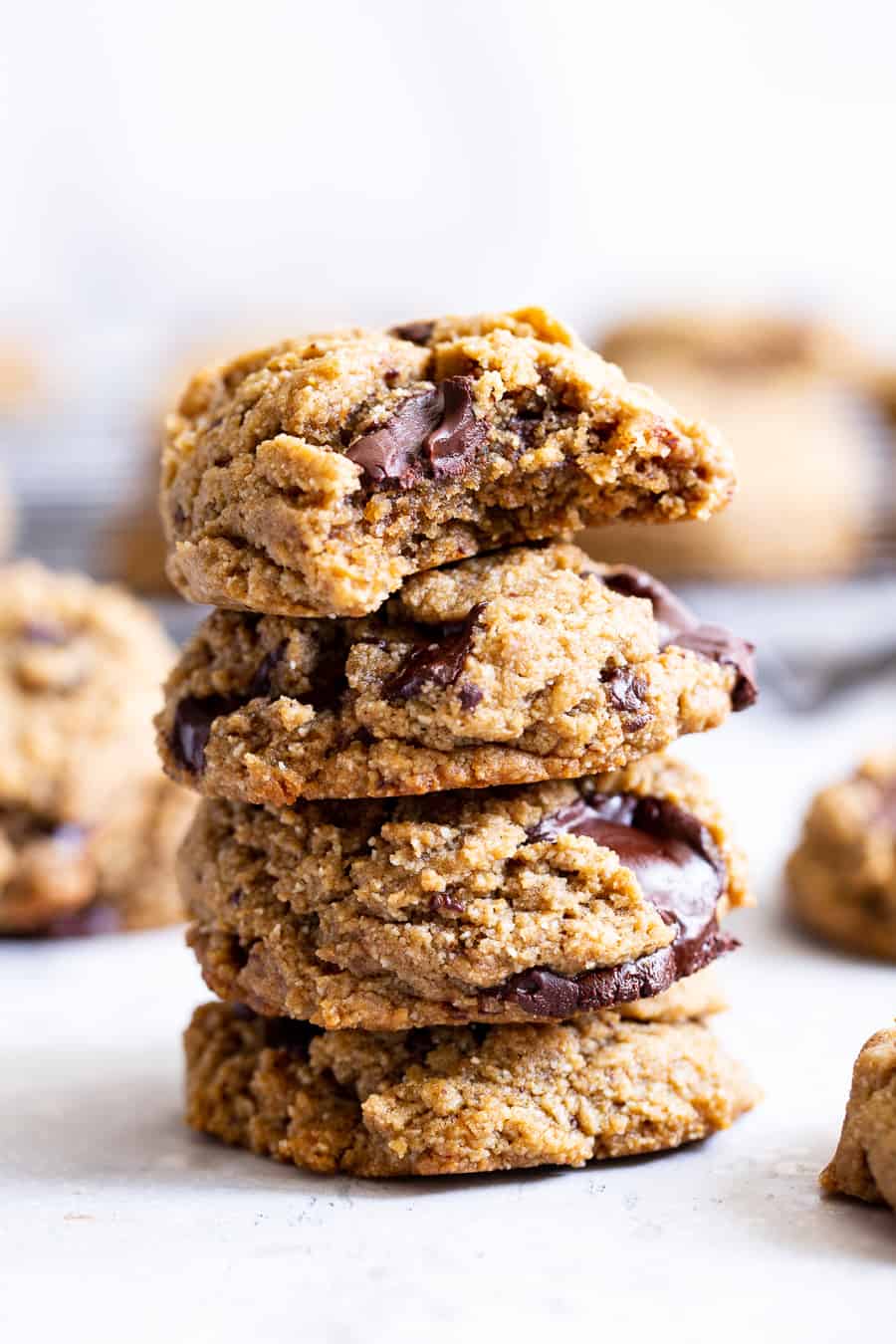These soft and chewy chocolate chunk protein cookies are packed with good for you ingredients but taste decadent!  Plant based vanilla protein, nut butter, pure maple syrup and almond flour make these paleo and vegan cookies just as healthy as they are delicious. #ad #paleo #vegan #cookies #glutenfree 