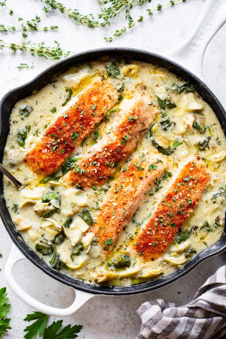 One Skillet Salmon with Creamy Spinach Artichoke Sauce {Whole30, Keto}