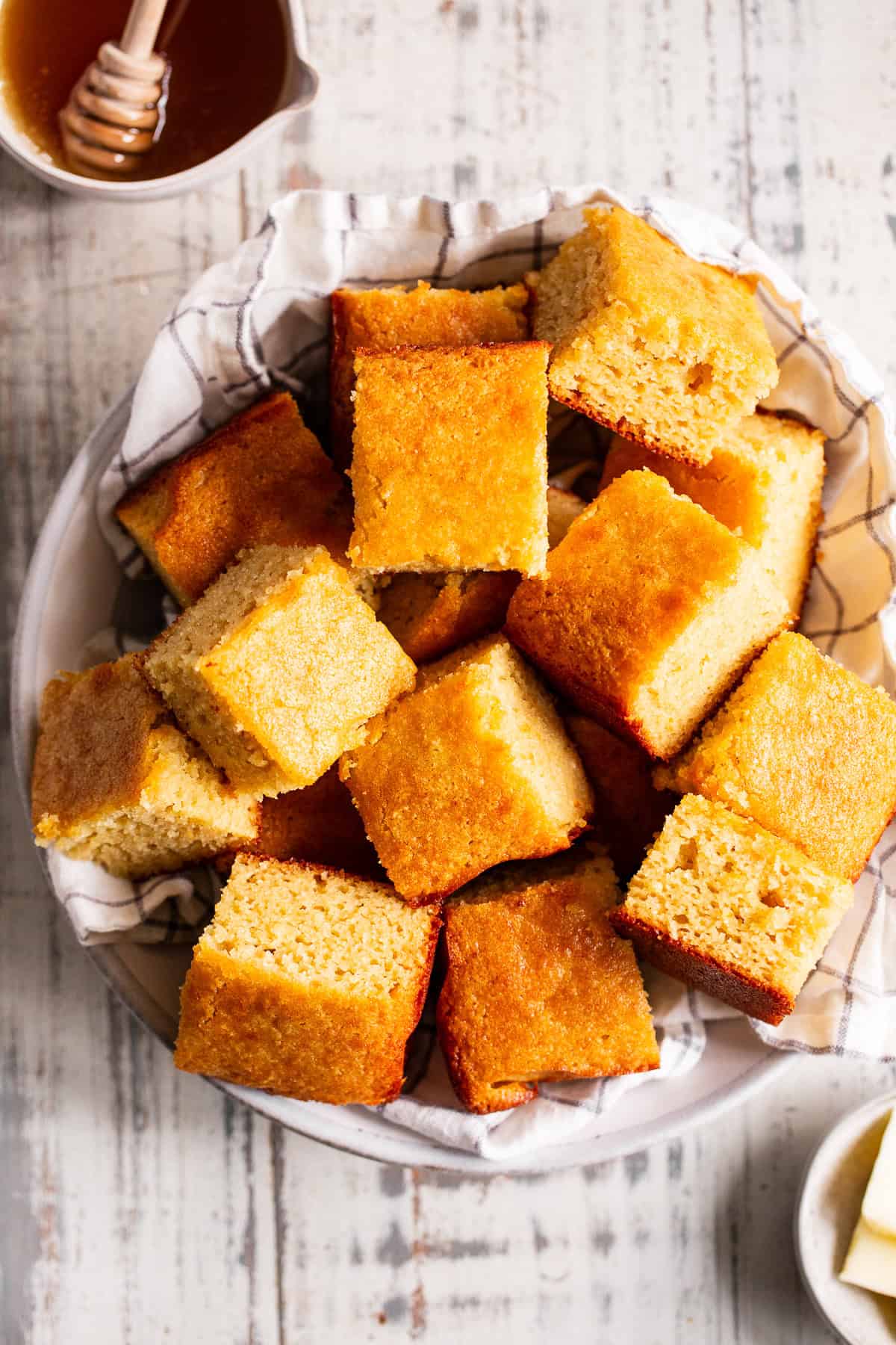 paleo cornbread cut into squares in a serving bowl