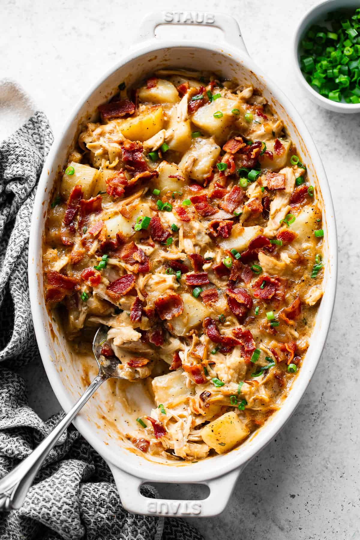 Overhead view of dairy-free chicken and potato casserole with crispy bacon