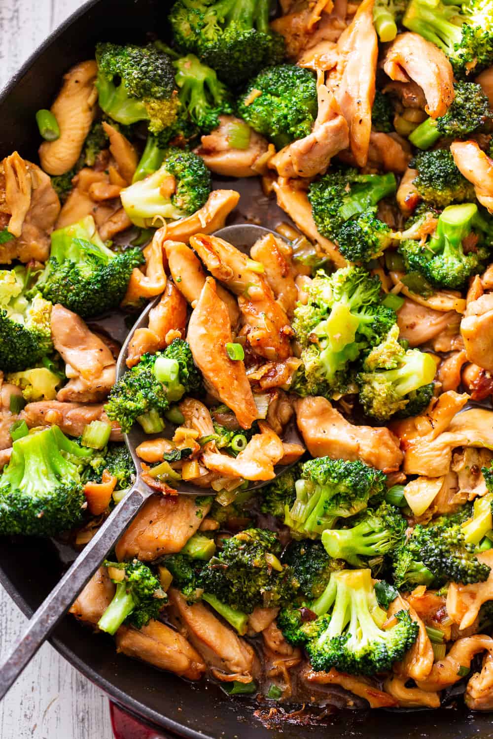 This quick and tasty paleo chicken and broccoli stir fry uses clean simple ingredients and is so much healthier than takeout but just as fast! It’s family approved and great for weeknight dinners. I love serving it over fried cauliflower rice to keep it paleo, Whole30 compliant and low carb too. #paleo #whole30 #cleaneating #keto