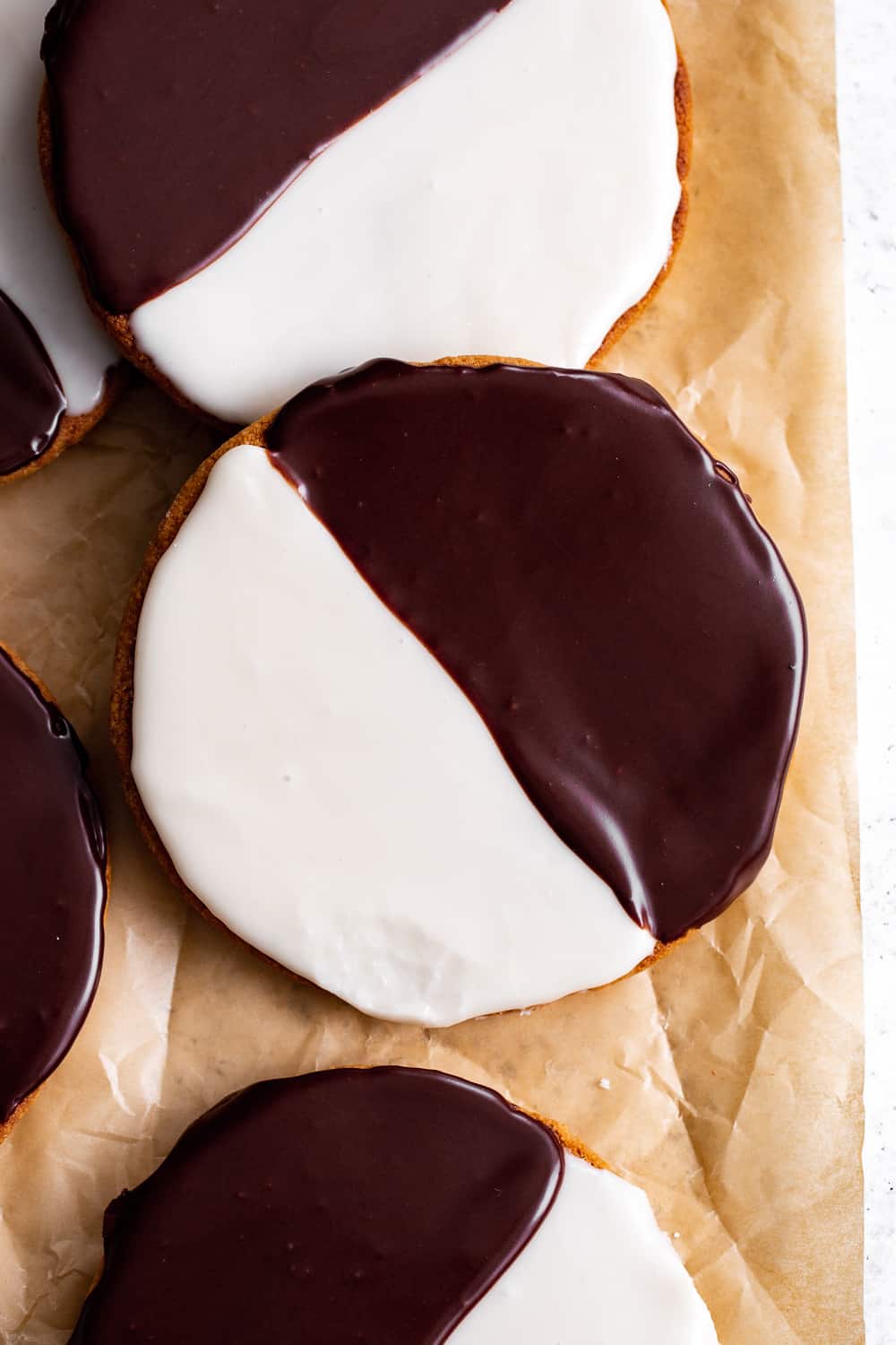 These homemade Black and White Cookies taste just like everyone's favorite New York City style bakery cookies - so much so that you'd never guess they're grain free!  This gluten free and grain free cookie recipe has dairy free and paleo options so everyone can enjoy these classic cookies at home!  #paleobaking #glutenfree #grainfree #paleo #cleaneating #glutenfreebaking #healthybaking