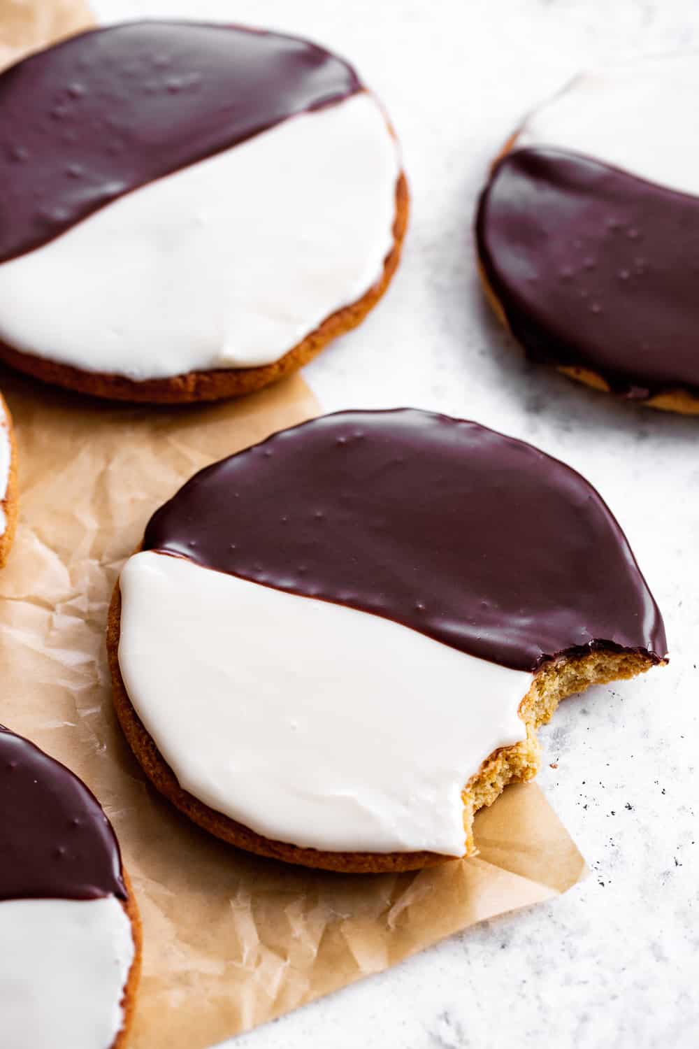 These homemade Black and White Cookies taste just like everyone's favorite New York City style bakery cookies - so much so that you'd never guess they're grain free!  This gluten free and grain free cookie recipe has dairy free and paleo options so everyone can enjoy these classic cookies at home!  #paleobaking #glutenfree #grainfree #paleo #cleaneating #glutenfreebaking #healthybaking
