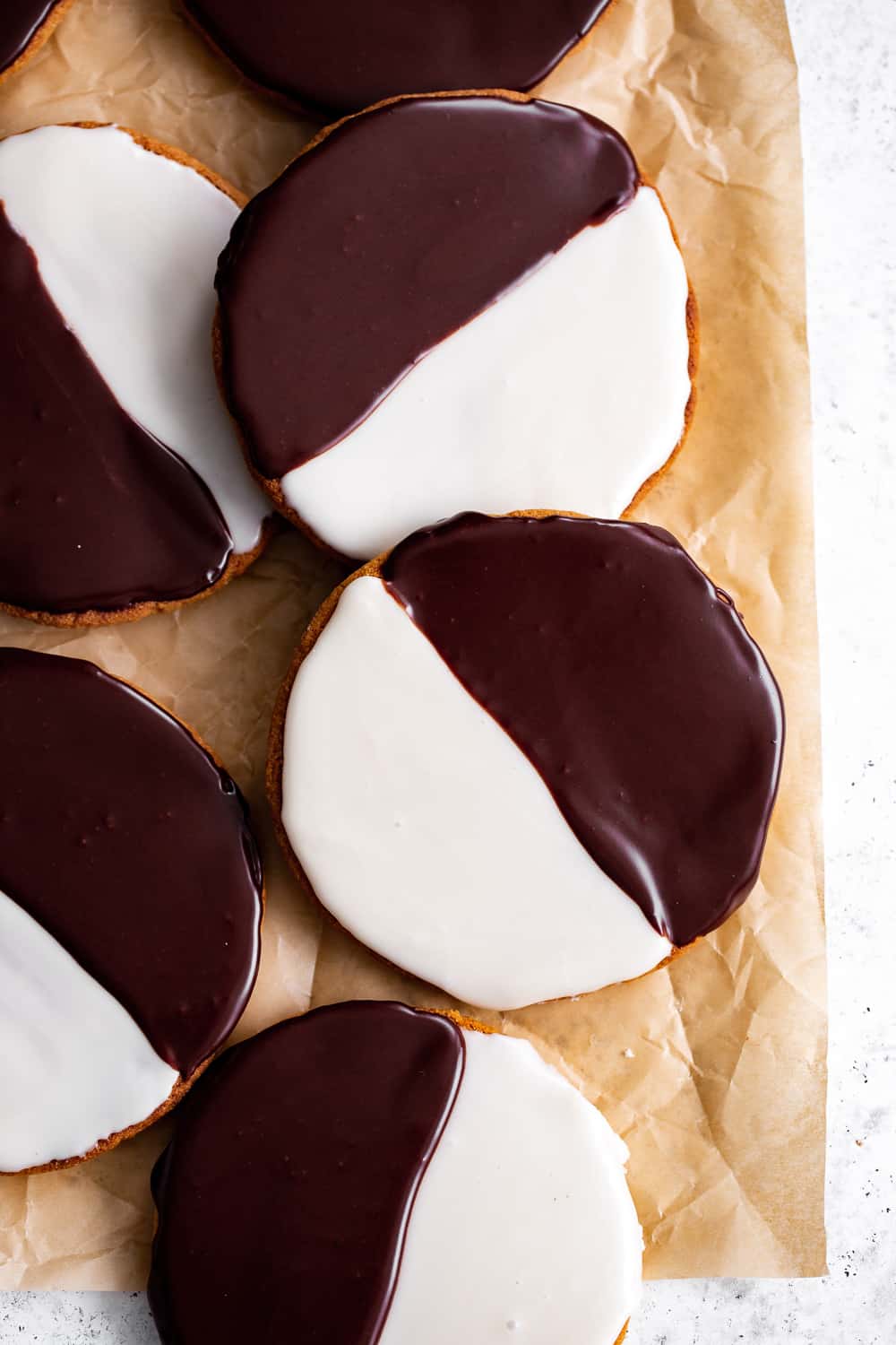 These homemade Black and White Cookies taste just like everyone's favorite New York City style bakery cookies - so much so that you'd never guess they're grain free!  This gluten free and grain free cookie recipe has dairy free and paleo options so everyone can enjoy these classic cookies at home!  #paleobaking #glutenfree #grainfree #paleo #cleaneating #glutenfreebaking #healthybaking