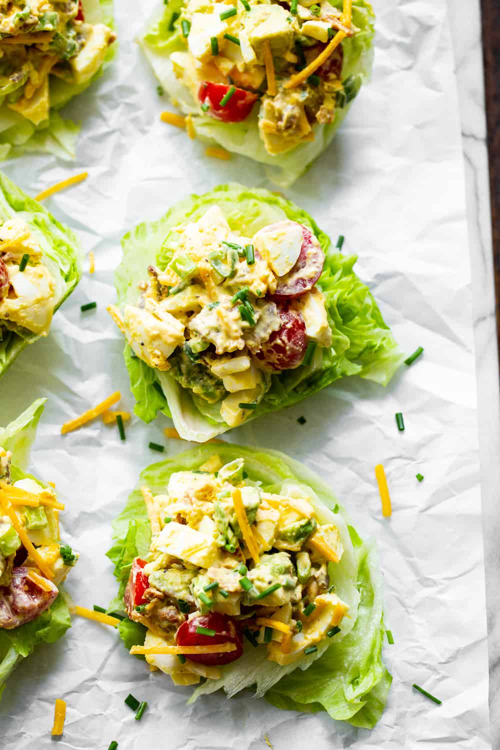 This cobb egg salad has all the goodies you’ll find in your favorite cobb salad!  Perfect for summer lunches and picnics, serve it over a simple green salad or in lettuce wraps for a protein packed meal with tons of flavor!  Paleo, Whole30, low carb and keto friendly. #paleo #keto #whole30 #cleaneating