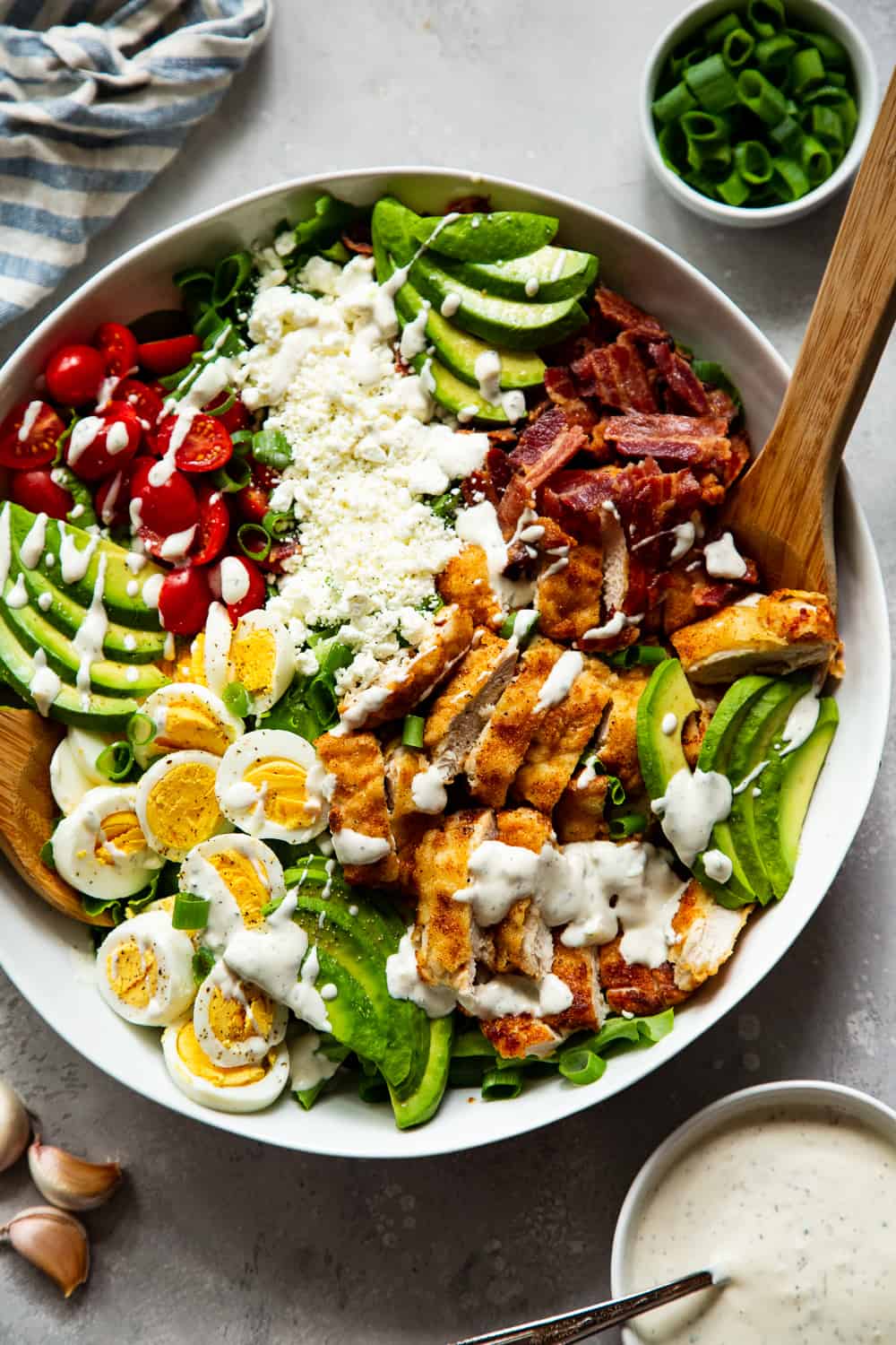 This crispy chicken cobb salad is my favorite one yet with flavorful crispy “breaded” chicken plus all the usual cobb salad goodies and a homemade garlic ranch dressing. It’s paleo, with a Whole30 option, low in carbs and family approved! #paleo #whole30 #cleaneating #keto #lowcarb