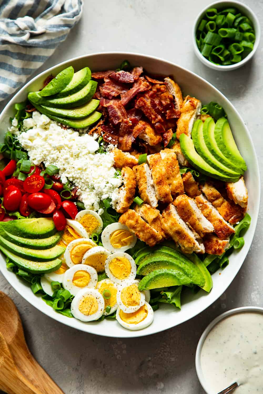 This crispy chicken cobb salad is my favorite one yet with flavorful crispy “breaded” chicken plus all the usual cobb salad goodies and a homemade garlic ranch dressing. It’s paleo, with a Whole30 option, low in carbs and family approved! #paleo #whole30 #cleaneating #keto #lowcarb