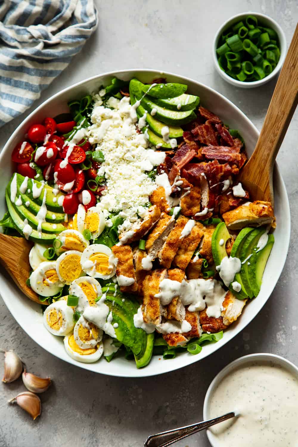 This crispy chicken cobb salad is my favorite one yet with flavorful crispy “breaded” chicken plus all the usual cobb salad goodies and a homemade garlic ranch dressing. It’s paleo, with a Whole30 option, low in carbs and family approved! #paleo #whole30 #cleaneating #keto #lowcarb