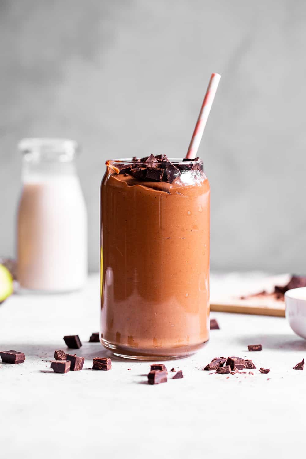 This creamy brownie batter chocolate smoothie is packed with good for you ingredients but tastes like dessert!  Have it for breakfast, a snack, or healthy dessert.  It's paleo friendly, dairy free, vegan and free of refined sugar.  Add your favorite chocolate protein powder for an extra chocolate kick! #paleo #vegan #cleaneating