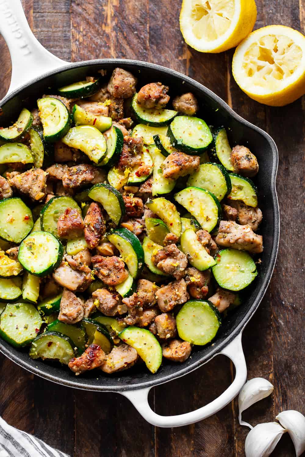 This Lemon Garlic Chicken Zucchini is packed with flavor, fast and easy for weeknights! Bite sized chicken thighs are perfectly seasoned and sautéed with zucchini and garlic then tossed with lemon juice and zest. Great alone or served over grain free noodles or cauliflower rice to keep it paleo, keto and Whole30. #paleo #whole30 #keto #cleaneating 
