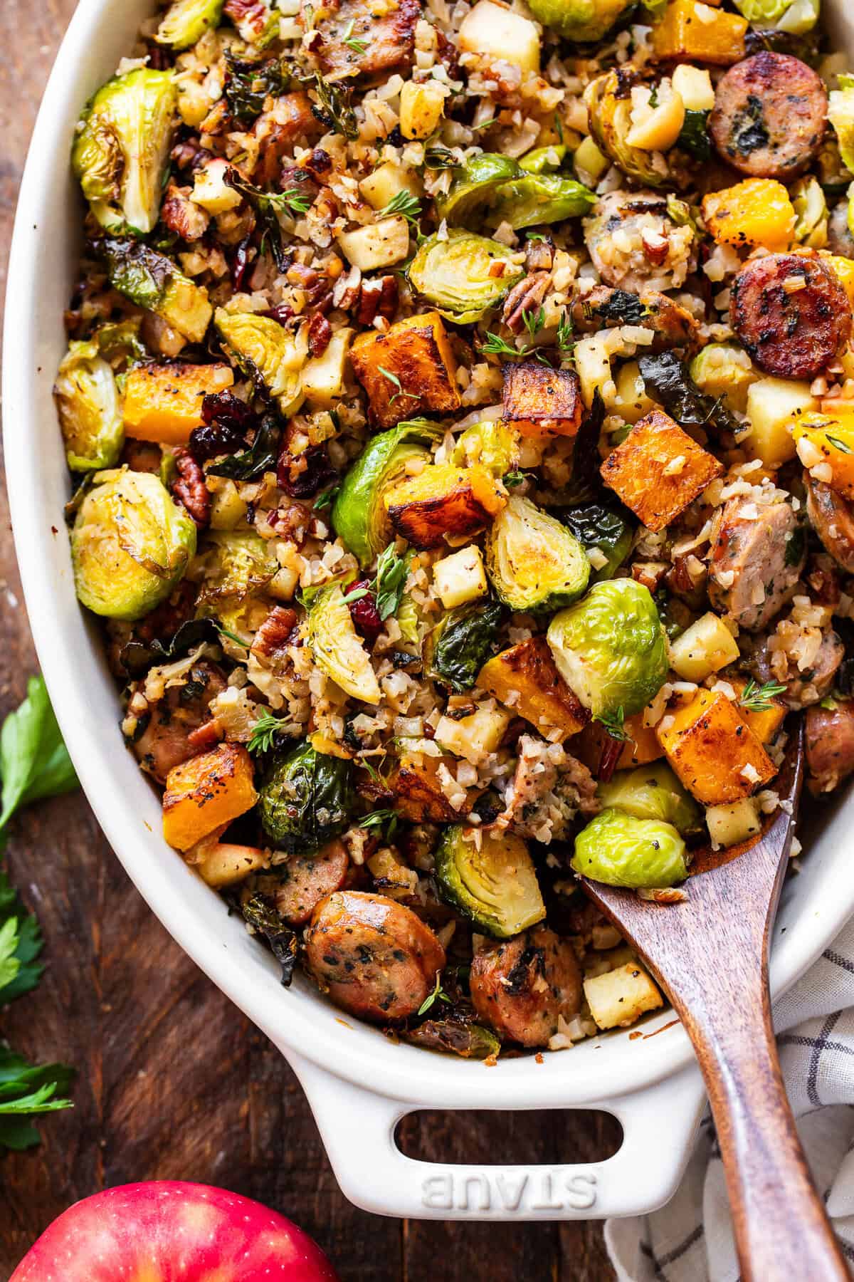 Fall casserole with roasted butternut squash, Brussels sprouts, apples, pecans and fresh herbs