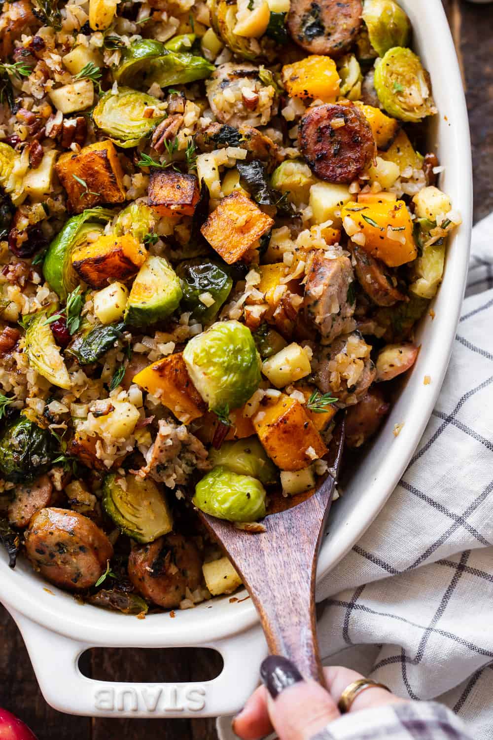 This savory and sweet harvest casserole is packed with veggies, protein, fresh herbs and all the best fall flavors! Serve it as a holiday side dish or a special seasonal meal. The leftovers are delicious for any meal! Paleo friendly, dairy free, Whole30. #paleo #whole30 #cleaneating 