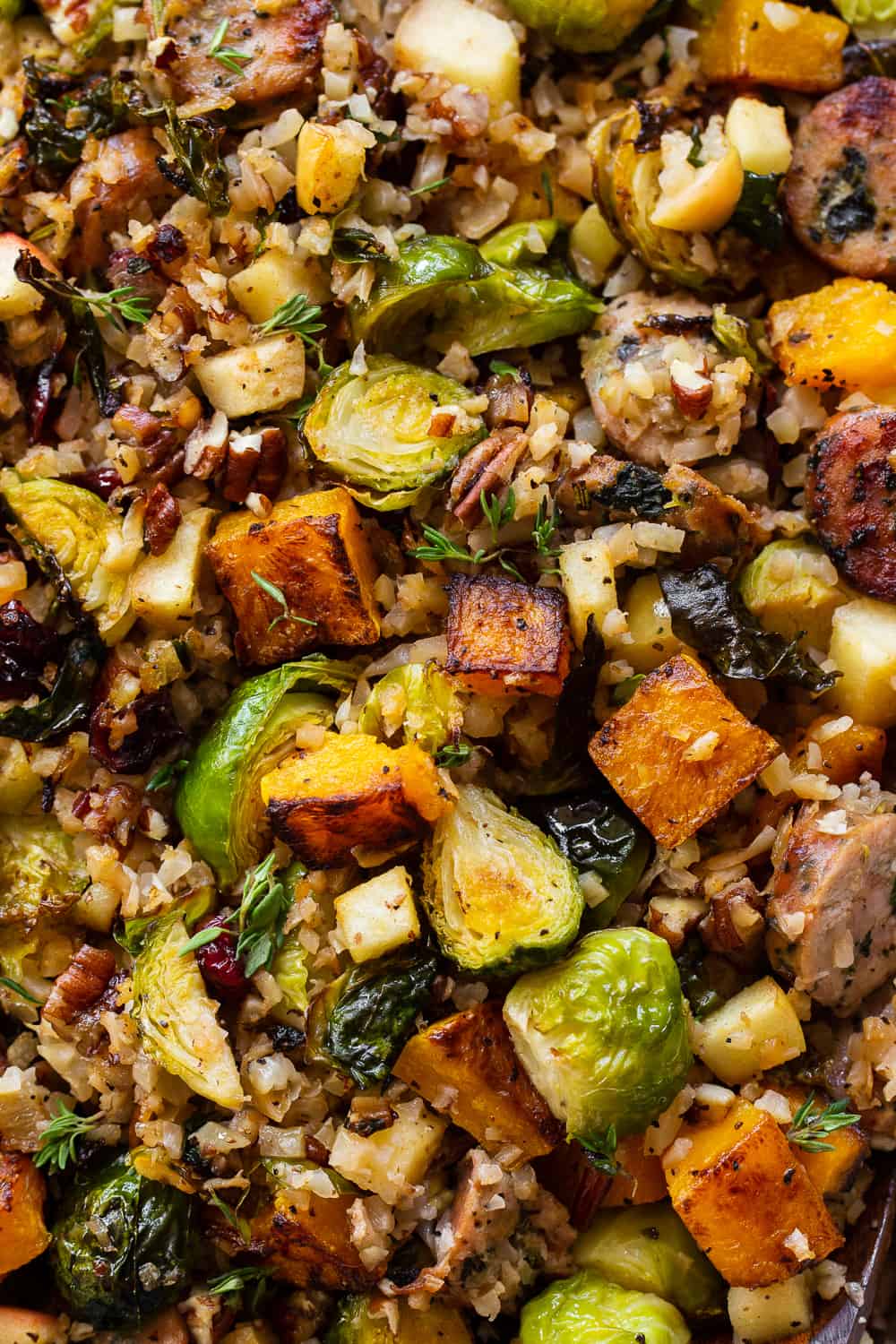 This savory and sweet harvest casserole is packed with veggies, protein, fresh herbs and all the best fall flavors! Serve it as a holiday side dish or a special seasonal meal. The leftovers are delicious for any meal! Paleo friendly, dairy free, Whole30. #paleo #whole30 #cleaneating 