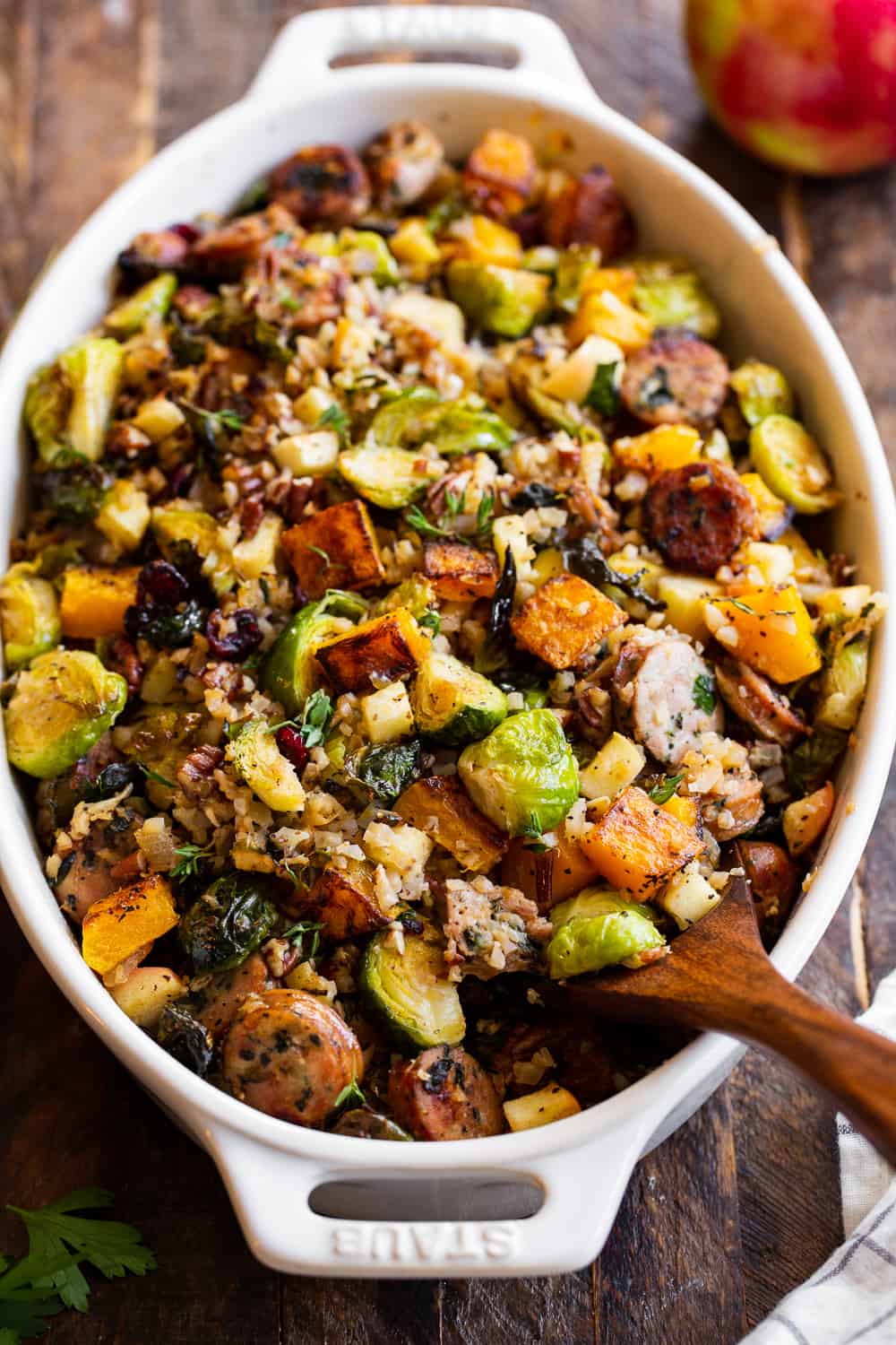 This savory and sweet harvest casserole is packed with veggies, protein, fresh herbs and all the best fall flavors! Serve it as a holiday side dish or a special seasonal meal. The leftovers are delicious for any meal! Paleo friendly, dairy free, Whole30. #paleo #whole30 #cleaneating 