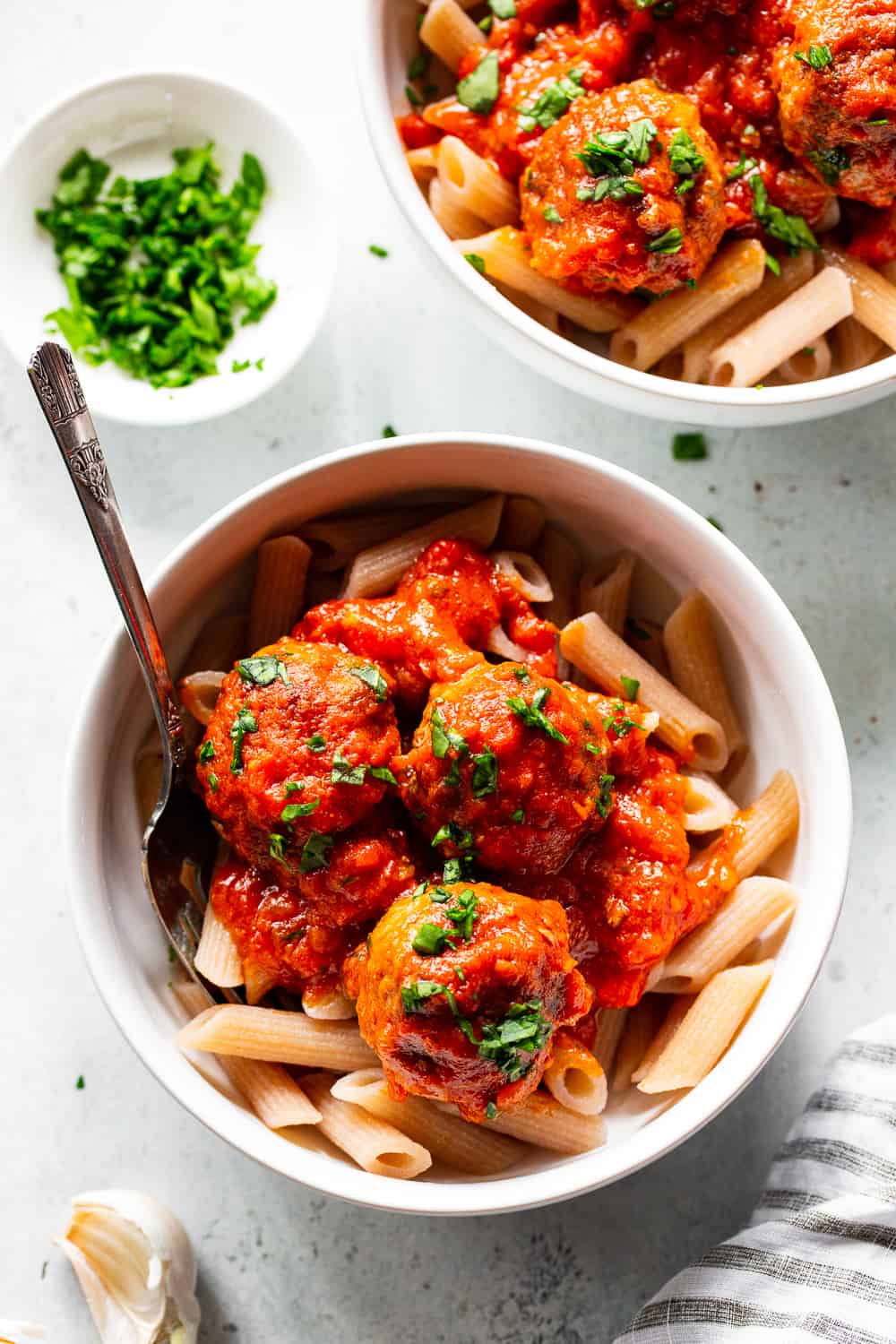 These quick skillet meatballs have been a favorite weeknight meal for my family for years!  You can prep and cook these meatballs in just 25 minutes and they never get complaints.  Serve over veggie noodles or spaghetti squash, with gluten free or grain free pasta, over sautéed greens or with a big green salad.  They're paleo, Whole30 and keto friendly. #paleo #keto #meatballs #lowcarb #cleaneating #whole30