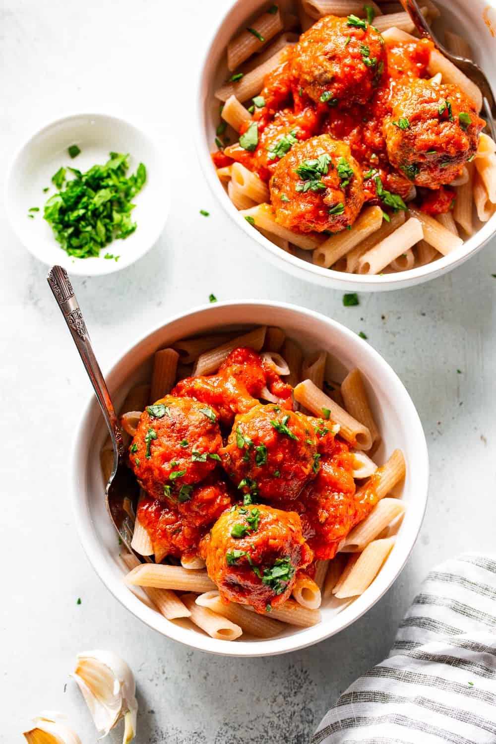 These quick skillet meatballs have been a favorite weeknight meal for my family for years!  You can prep and cook these meatballs in just 25 minutes and they never get complaints.  Serve over veggie noodles or spaghetti squash, with gluten free or grain free pasta, over sautéed greens or with a big green salad.  They're paleo, Whole30 and keto friendly. #paleo #keto #meatballs #lowcarb #cleaneating #whole30