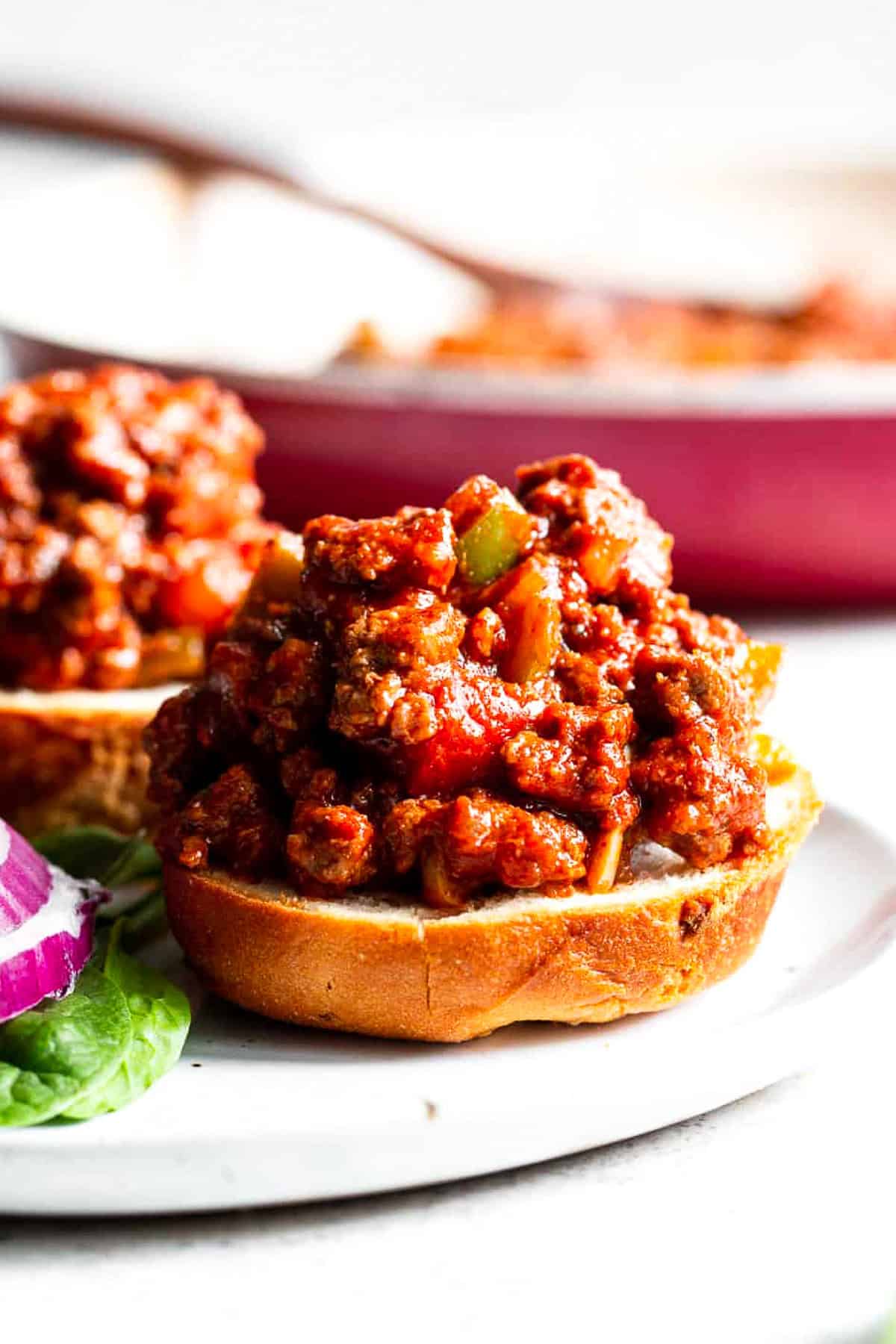 paleo sloppy joes on bun with rich saucy ground beef and peppers