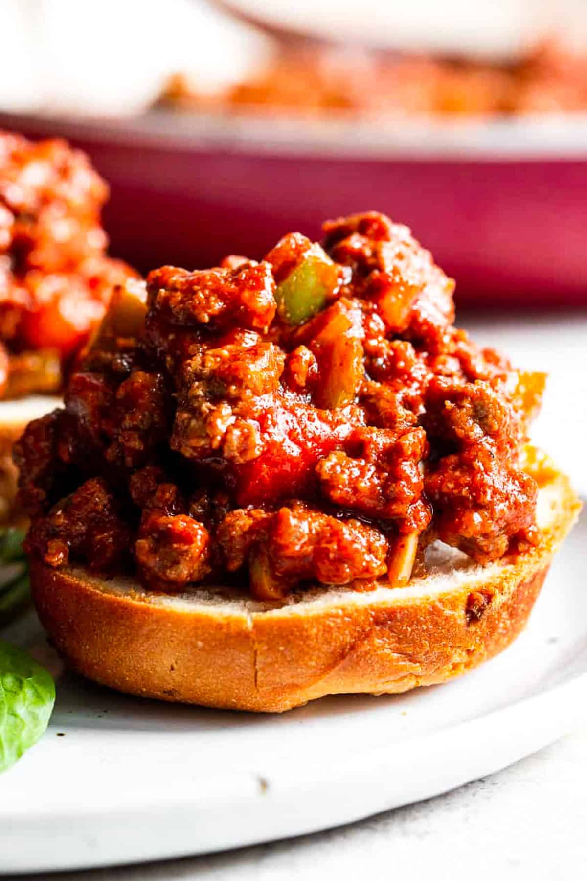 paleo sloppy joes on bun with rich saucy ground beef and peppers