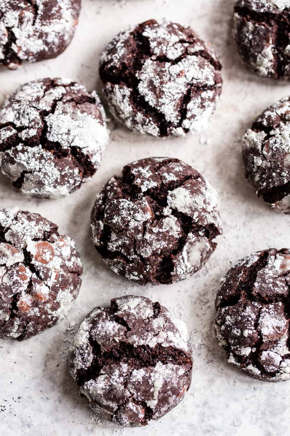 These easy paleo chocolate crinkle cookies are sure to become a holiday baking favorite! They have double the chocolate and a chewy brownie-like inside. Gluten free, grain free and dairy free. #paleo #glutenfree #cleaneating #christmascookies #christmas #paleobaking